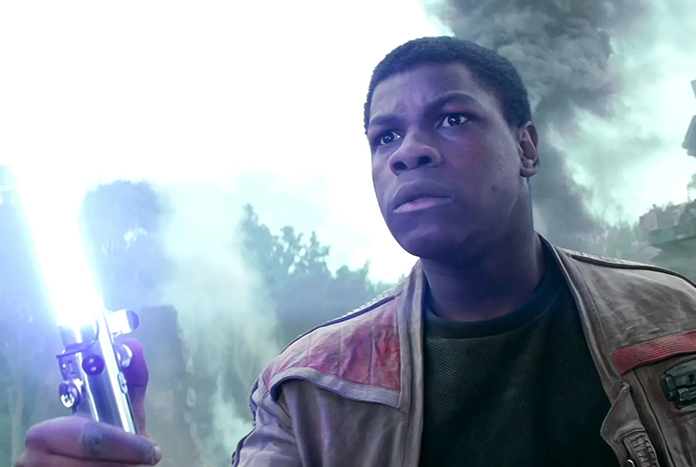 John-Boyega-Finn-with-lightsaber-Aug25